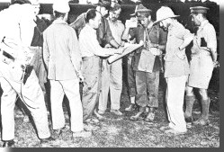 Wingate and officers being shown photos of block